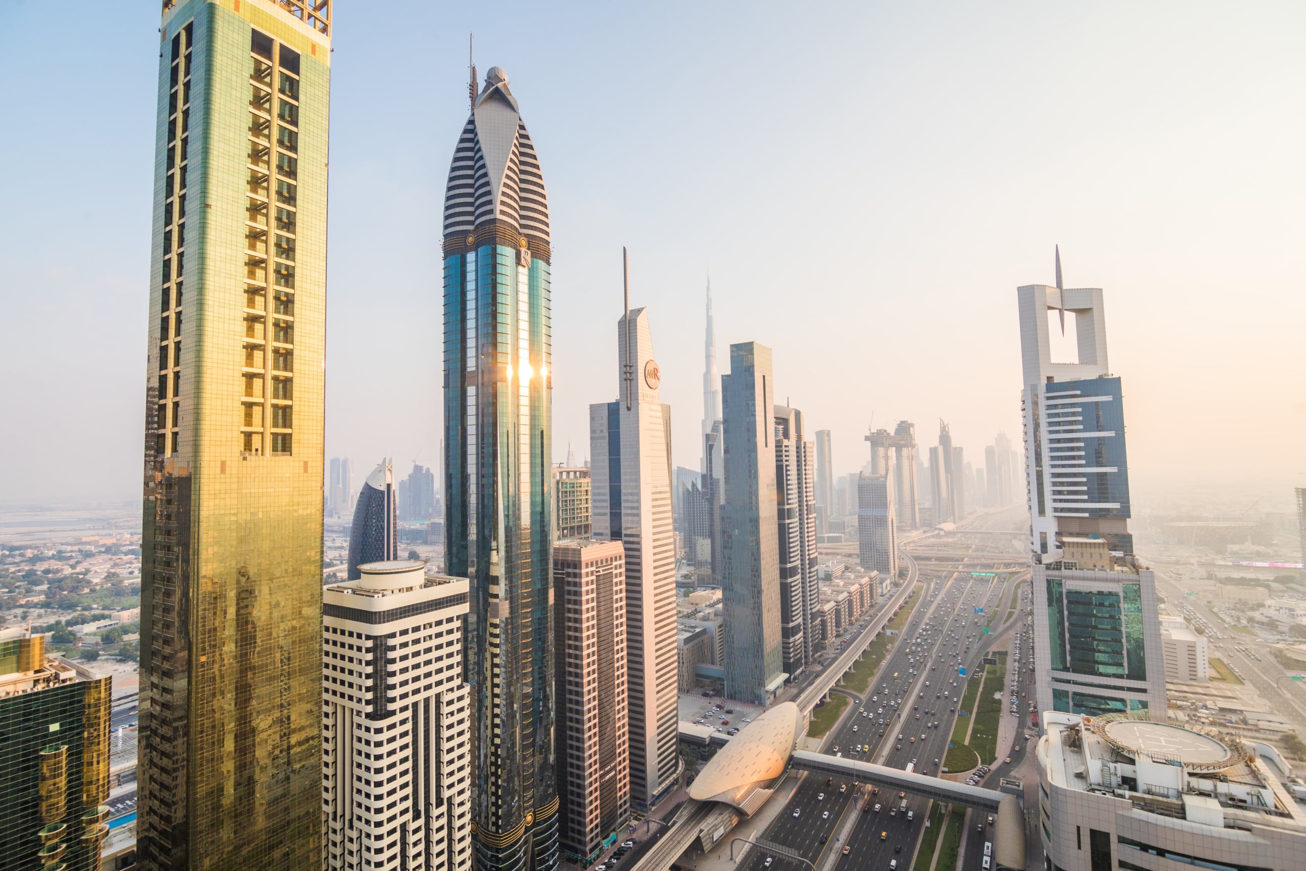 dubai-skyline-downtown-skyscrapers-sunset-modern-architecture-concept-with-highrise-buildings-world-famous-metropolis-united-arab-emirates-min